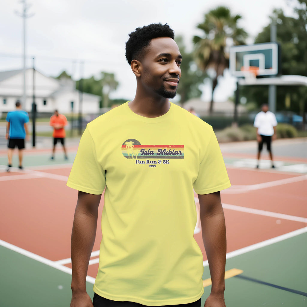 Man wearing a bright yellow t-shirt with text on an outdoor basketball court