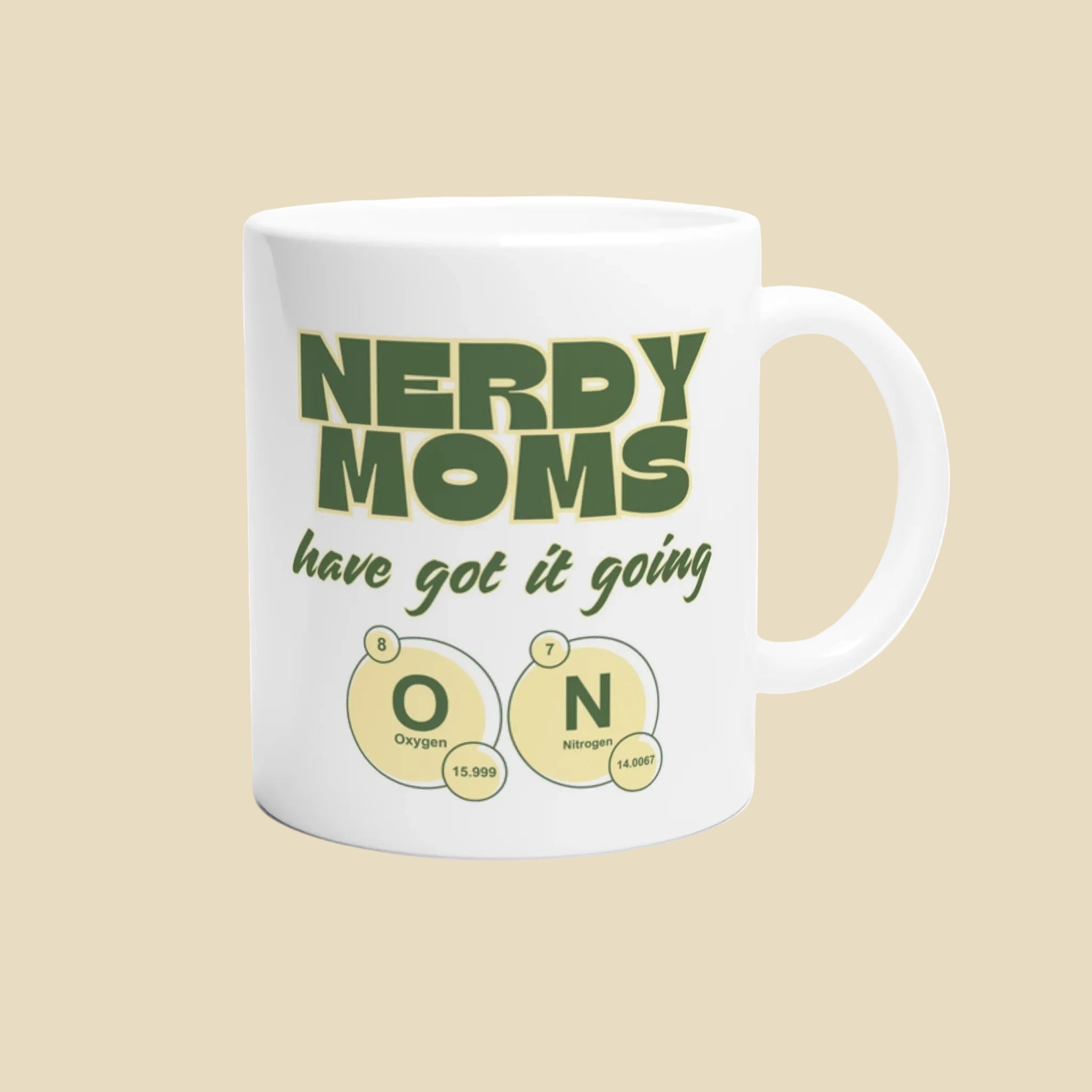 White mug with green text 'NERDY MOMS have got it going ON' on a white background