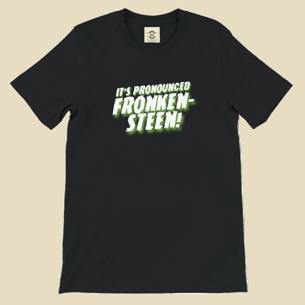 Black t-shirt with green text 'IT'S PRONOUNCED FRONKEN- STEEN!' on a white background
