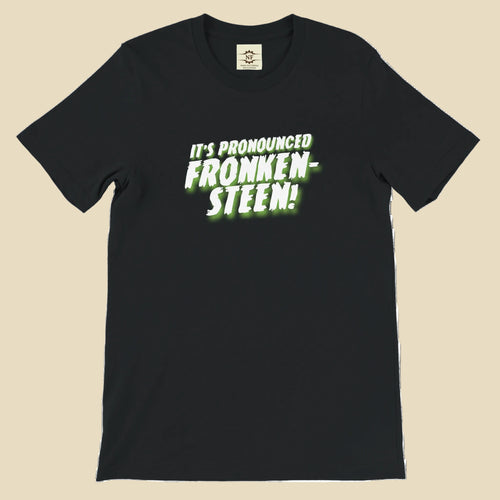 Black t-shirt with green text 'IT'S PRONOUNCED FRONKEN- STEEN!' on a white background