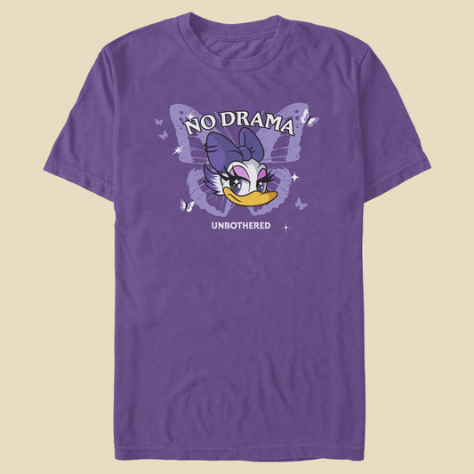 A purple t-shirt with butterflies and Daisy Duck's face with the phrases No Drama above her and Unbothered under her against an off-white background