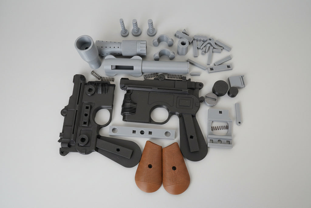 Disassembled gun on a wooden surface