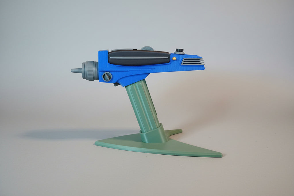 Blue and green toy on a brown surface