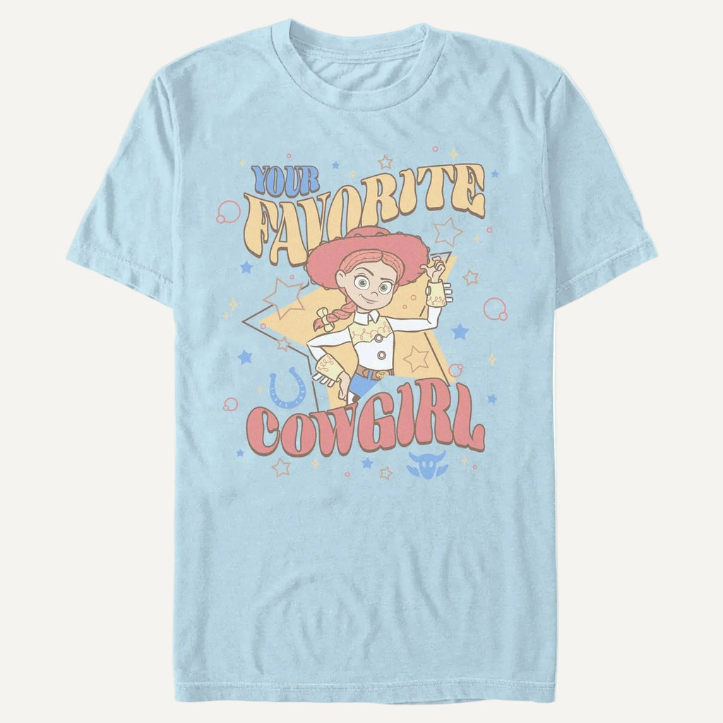 A light blue t-shirt with the phrase Your Favorite Cowgirl and an animated cowgirl toy on an off-white background